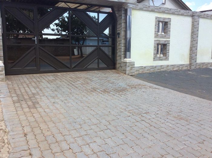 For Sale: House in Protea Glen with security, parking, and nearby schools.