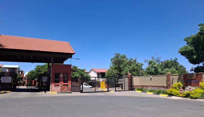 For Sale: Townhouse in Waterfall Heights with pool, security, and private balcony.