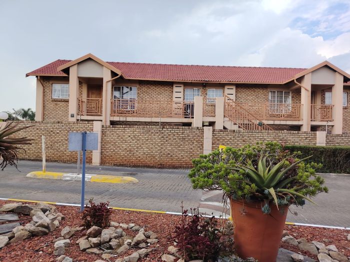 For Sale: Rooihuiskraal North Apartment with pool, garage, and tenant in place.