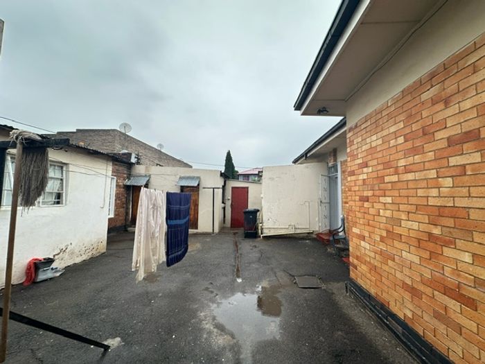 For Sale: Bellevue East House with rental income potential, cottages, and ample parking.