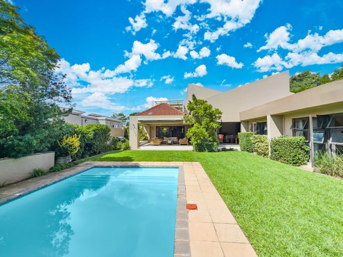 Kyalami Estates House For Sale: 6 bedrooms, wine cellar, pool, and extensive amenities.