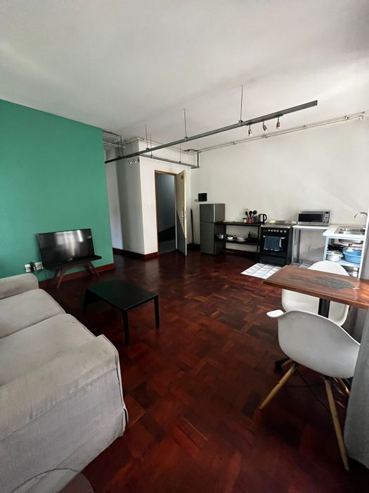 1-Bedroom Apartment For Sale in Maboneng with balcony, kitchenette, and secure complex.