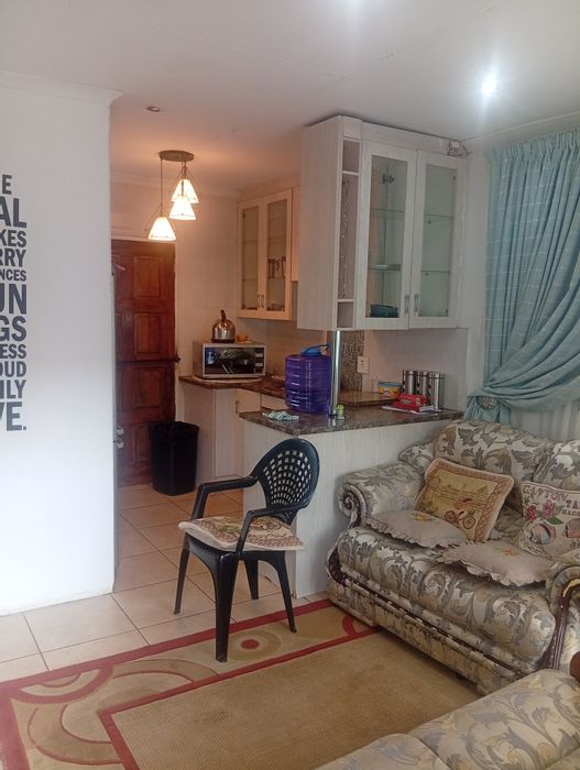 For Sale: 2-Bedroom House in Protea Glen with Remote Garage and Paved Yard.