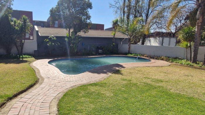 For Sale: Buccleuch Townhouse with private garden, pool access, and 24-hour security.