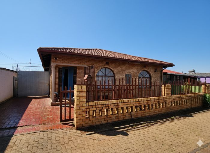 For Sale: Spacious 4-Bedroom House with Income-Generating Cottages in Lenasia Ext 11.