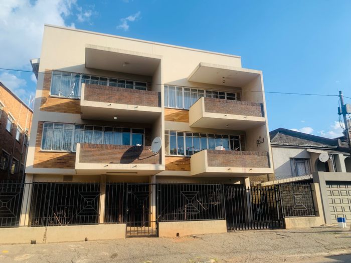 For Sale: Bellevue House with 4 apartments, income potential, and parking.