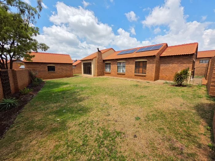 For Sale: Monavoni Townhouse with garden, indoor braai, solar panels, and security.