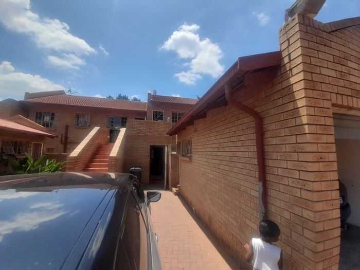 For Sale: 3-Bedroom Apartment in Turffontein with Garden, Garage, and Secure Complex.