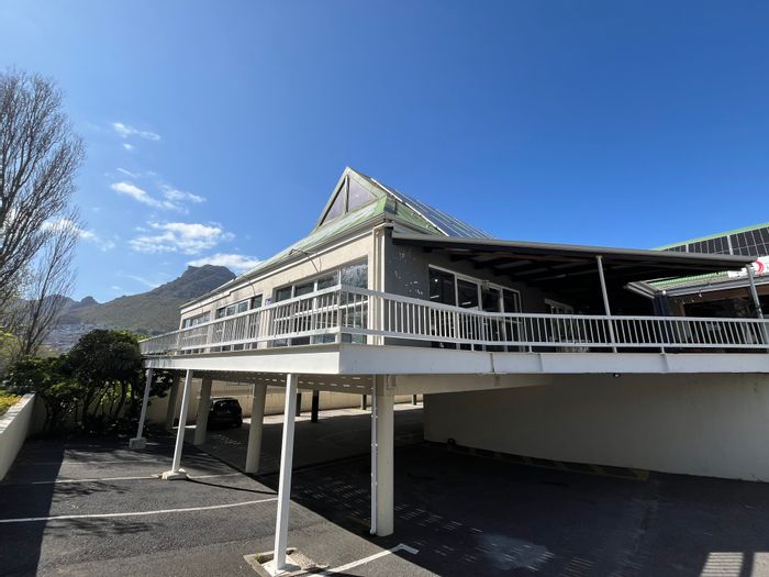 Retail space to rent in Hout Bay Central with parking, storage, and balcony.