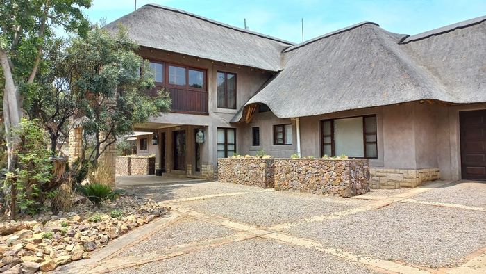 Lodge for sale in Zebula Golf Estate: 3 bedrooms, income-generating chalets, entertainment area.