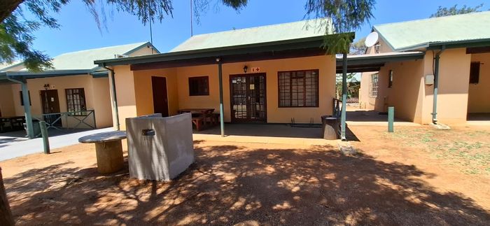For Sale: Townhouse in Bela Bela Central with pool, entertainment area, and private patio.