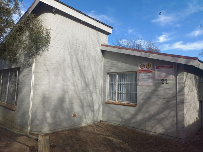 Brandwag House For Sale: 17-bed student accommodation with security, kitchen, and braai area.