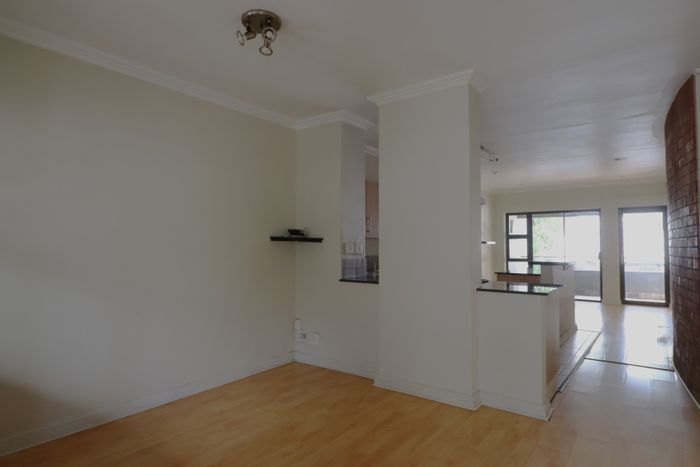 For Sale: 2 Bed, 2 Bath Apartment in Rivonia with covered parking and serene views.