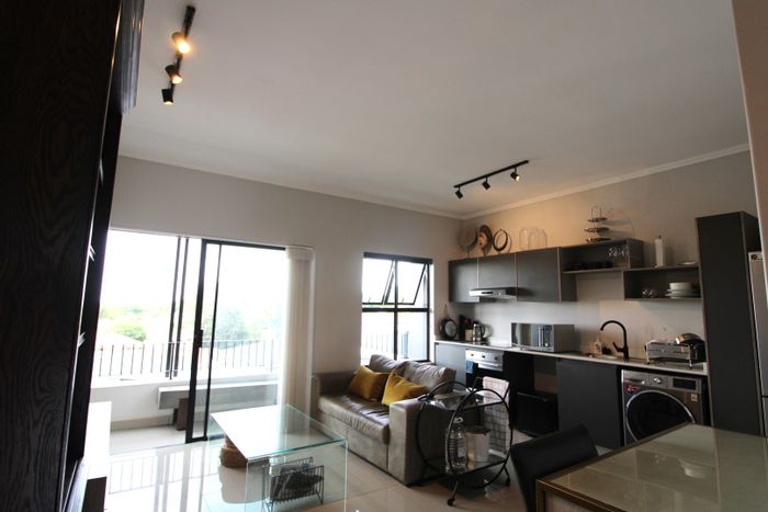 Bryanston Apartment For Sale: 1-bedroom, secure parking, open-plan living, tranquil views.