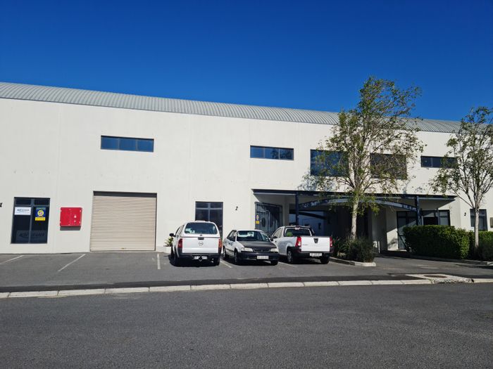 310m² Industrial Warehouse To Rent in Saxenburg Park 2 with mezzanine and roll-up door.