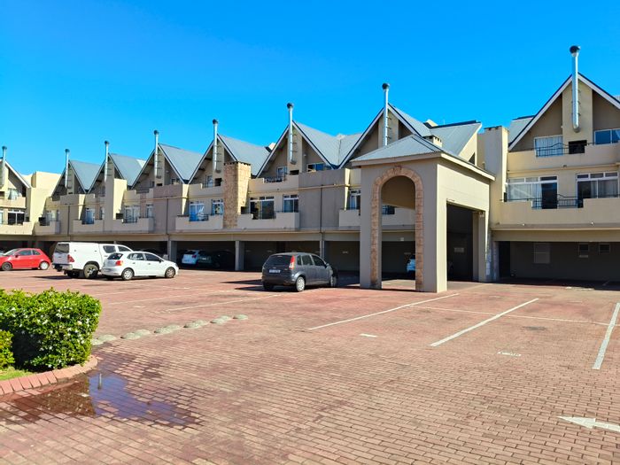 For Sale: Apartment in Whispering Pines with 24-hour security, pool, and rental income.