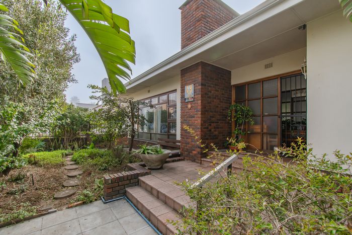 For Sale: House in Strand North with 3 bedrooms, garage, and beach access.