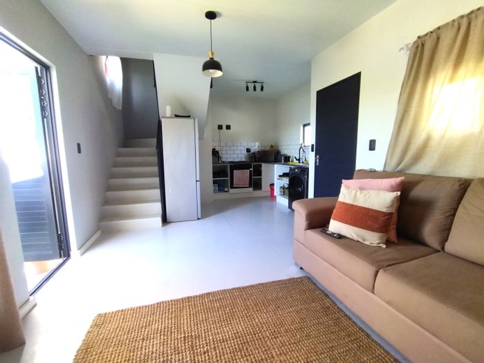 For Sale: The Conifers Townhouse with 2 Bedrooms, Yard Space, and Open Parking.