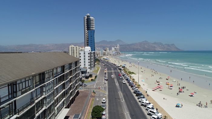 For Sale: Apartment in Strand North with enclosed balcony, garage, and community amenities.