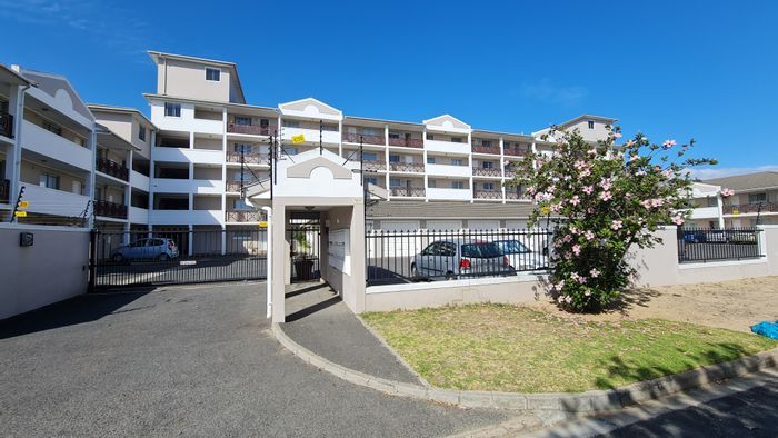 For Sale: Apartment in Strand North with pool, garden, and secure access.