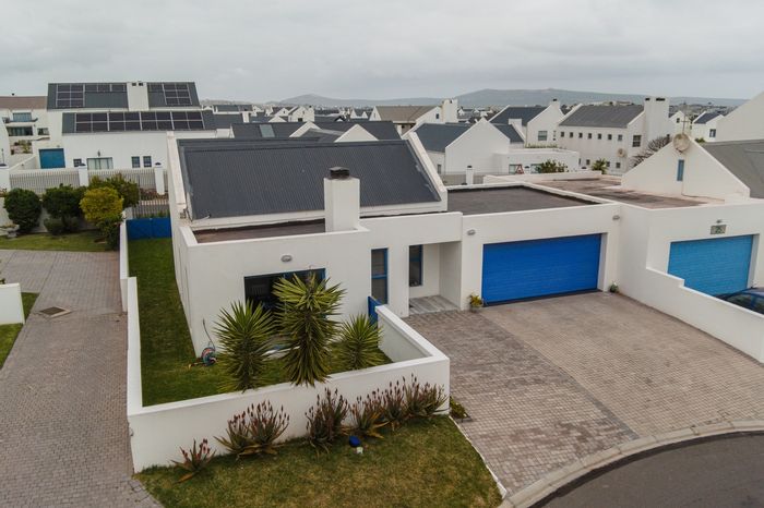 For Sale: House in Blue Lagoon with garden, double garage, and coastal access.