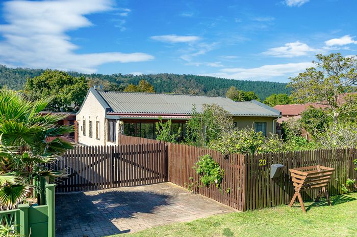 House For Sale in The Village: 3 bedrooms, borehole, garages, and enclosed sunroom.