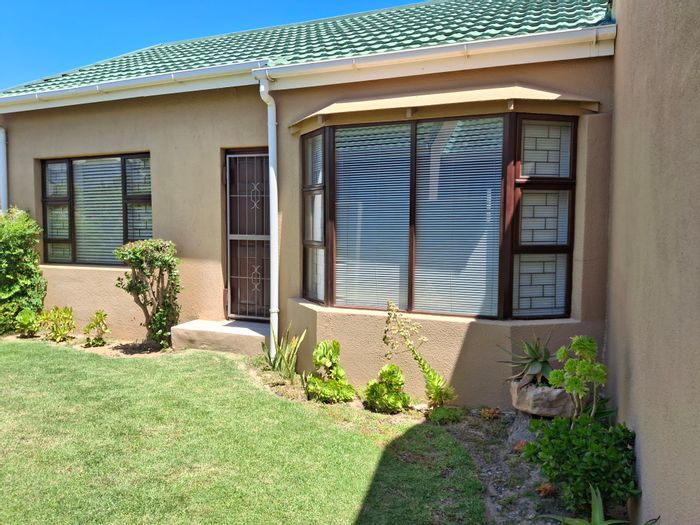 For Sale: Townhouse in Strand South with gardens, garage, and security features.