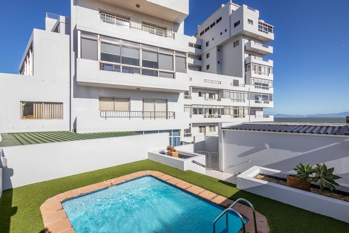 2-bedroom apartment in Strand North with pool, parking, and beach access. To Rent.