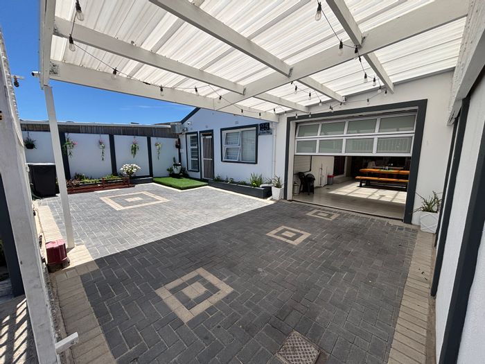 House for Sale in Strandfontein: Open-plan living, entertainment area, security features.