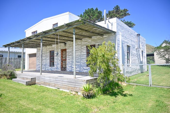 For Sale: House in Pringle Bay Central with ocean views, garden, and renovation potential.