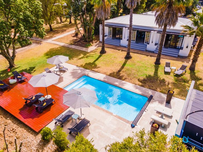 For Sale: Guest House in Swellendam Central with 7 suites, pool, and gardens.