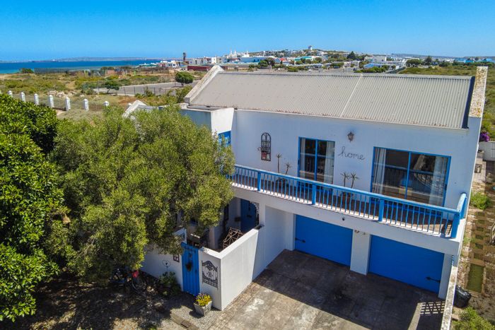 For Sale: House in Blue Lagoon with pool, spacious yard, and beach access.