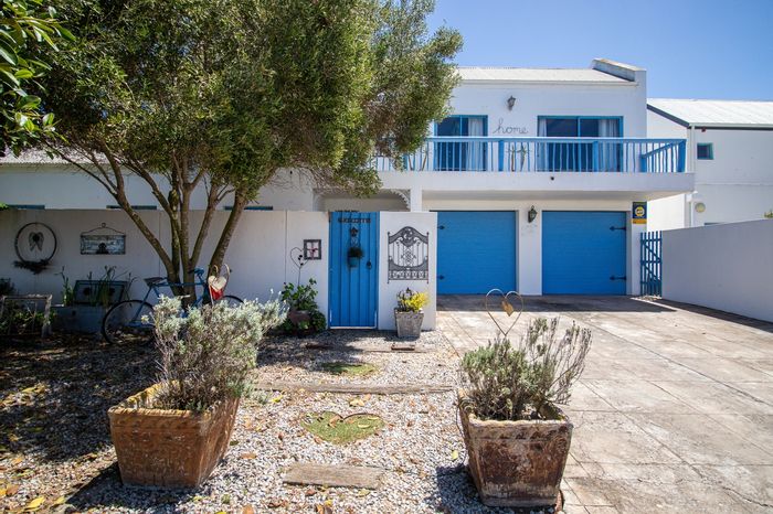 Charming Blue Lagoon house with garden, rock pool, and spacious living areas for sale.