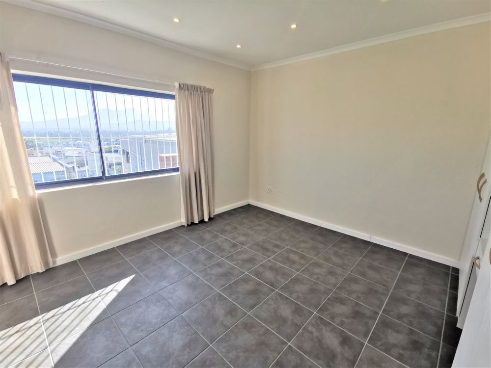 MAIN BEDROOM DOWNSTAIRS WITH SEA AND MOUNTAIN VIEWS