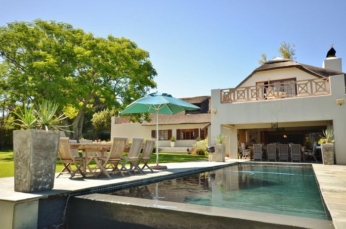 Farm for Sale in Stellenbosch Farms: 5-bedroom home, pool, vineyard potential.