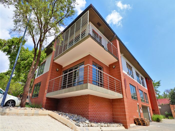 Fourways Office To Rent: Ground-floor space with boardrooms, kitchen, and shared patio.