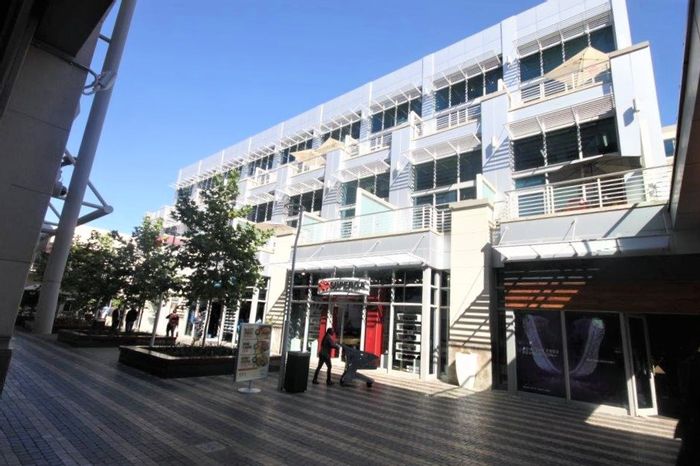 Loft office space to rent in Rosebank, featuring balconies and rooftop terrace.
