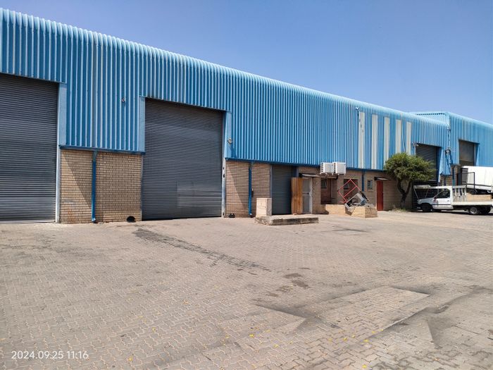 Industrial Warehouse To Rent in North Riding with dual roller doors and ample yard space.