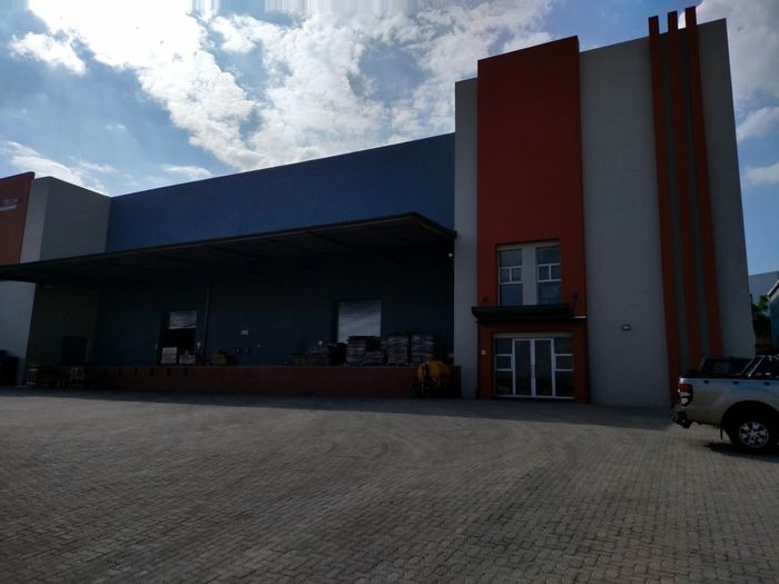 Industrial property for sale in Cosmo Business Park with ample warehouse space and security.