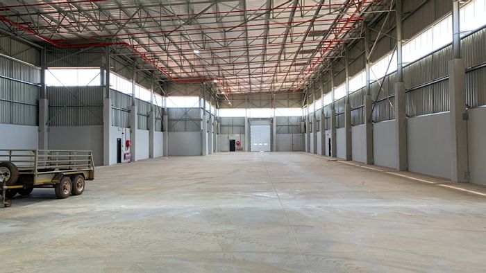 Industrial warehouse to rent in Jet Park with roller doors and office space.