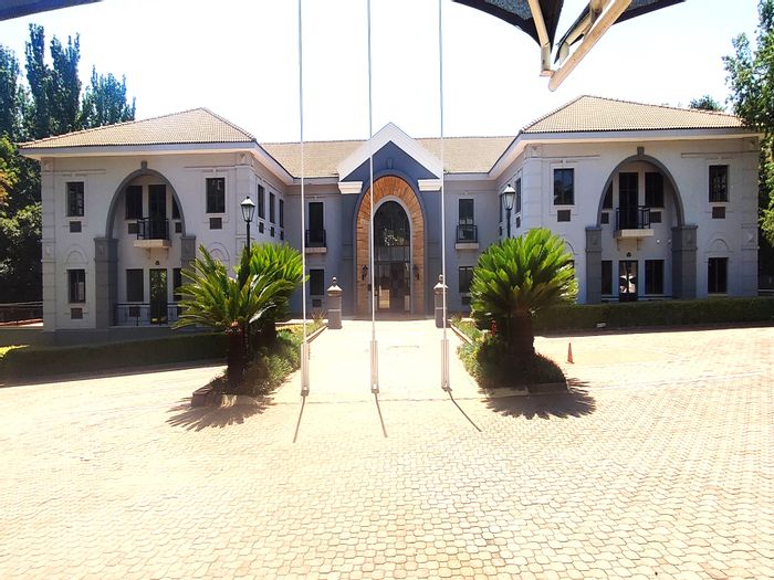 Office To Rent in Hyde Park: Secure building with balconies, parking, and fibre connectivity.