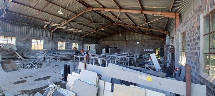 For Sale: Industrial property in Airport Industrial with office, workshop, and rental income.