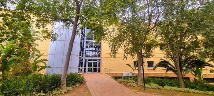 Office to Rent in Woodmead: White boxed unit, backup power, scenic park setting.