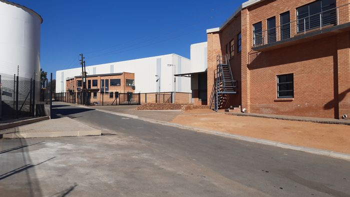 Industrial property for sale in Linbro Park with multiple roller doors and office space.