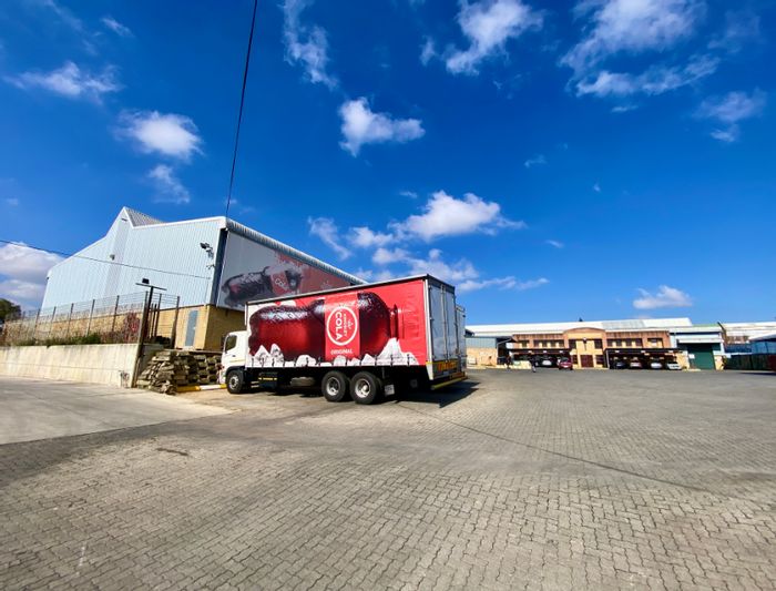 For Sale: Industrial property in Randjespark with extensive yard and office space.