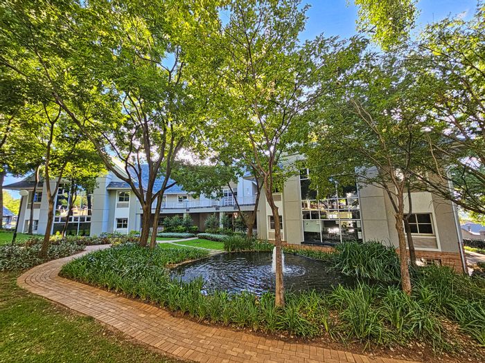 Bryanston Office To Rent: Natural light, security, patio, and direct shopping access.