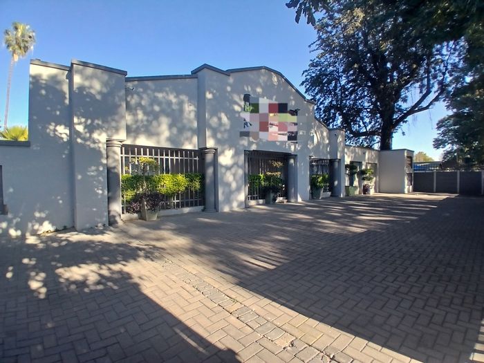 Rustenburg Central Guest House For Sale: Pool, gardens, dual kitchens, rental income potential.