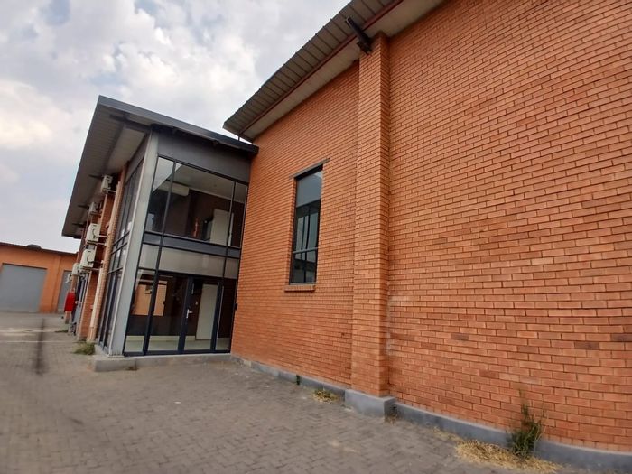 Industrial warehouse to rent in Waterval East with offices and spacious yard.