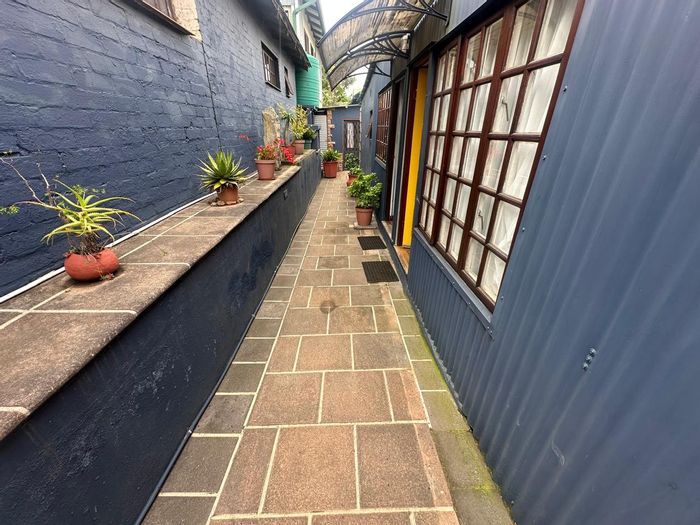 For Sale: Guest House in Kaapsche Hoop with 9 bedrooms, outdoor braai, and income potential.