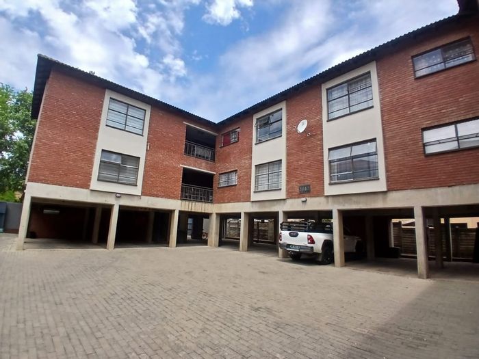 Rustenburg Central Commercial For Sale: Three-storey building with flats and business potential.